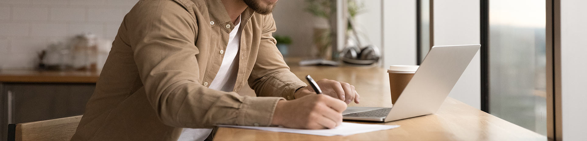 Photo of man working on laptop